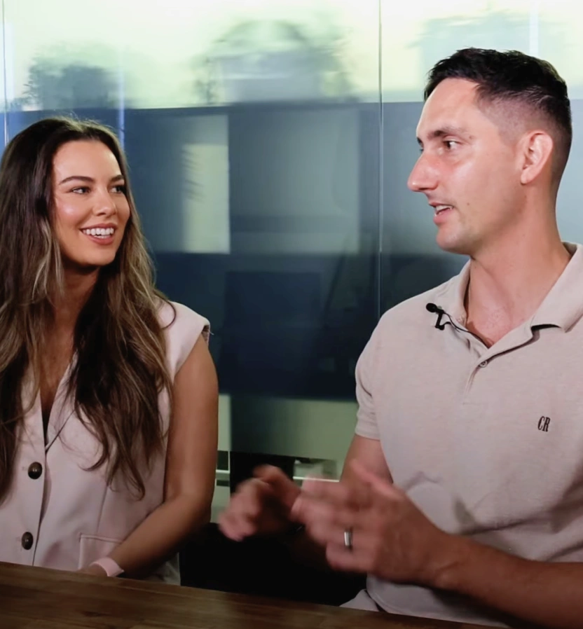 Jye and Sophie talking at a table