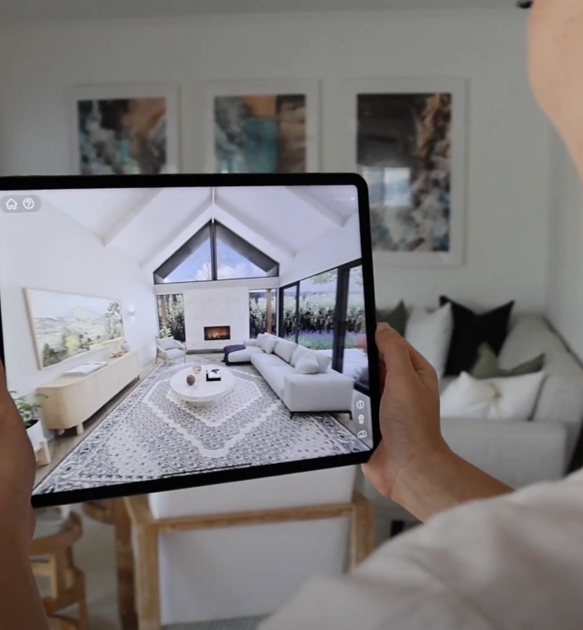 A tablet showing a living room with a raked ceiling